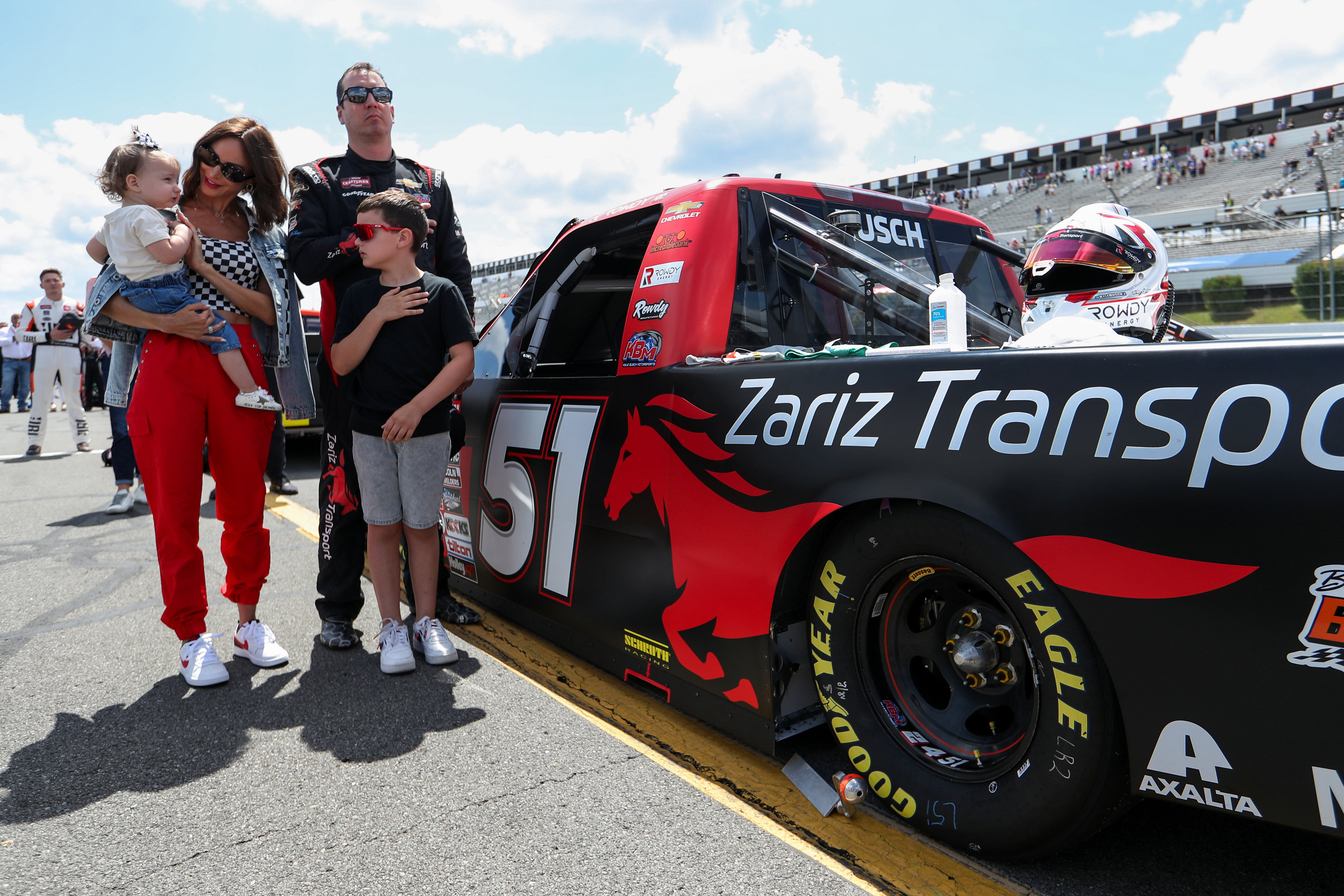 Kyle Busch stands with his wife Samantha Busch and children Brexton and Lennix prior to the CRC Brakleen 150 at Pocono Raceway - Source: Imagn